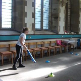 Girl holding a cricket bat