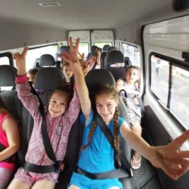 Smiling girls in minivan