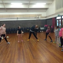 Girls learn football skills