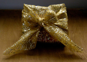 Christmas gift in reusable eco-friendly wrapping